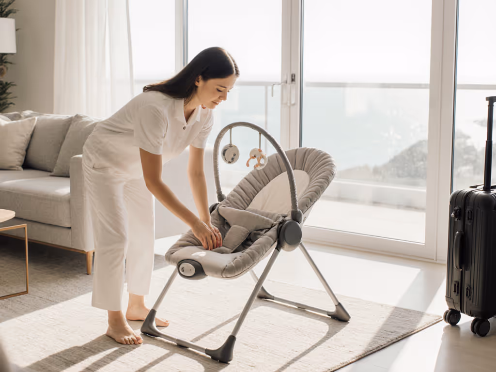 caregiver_checking_baby_bouncer_setup_in_a_vacation_rental_living_room